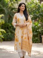 Front view of the mustard yellow and white printed cotton kurta set with trousers and matching dupatta